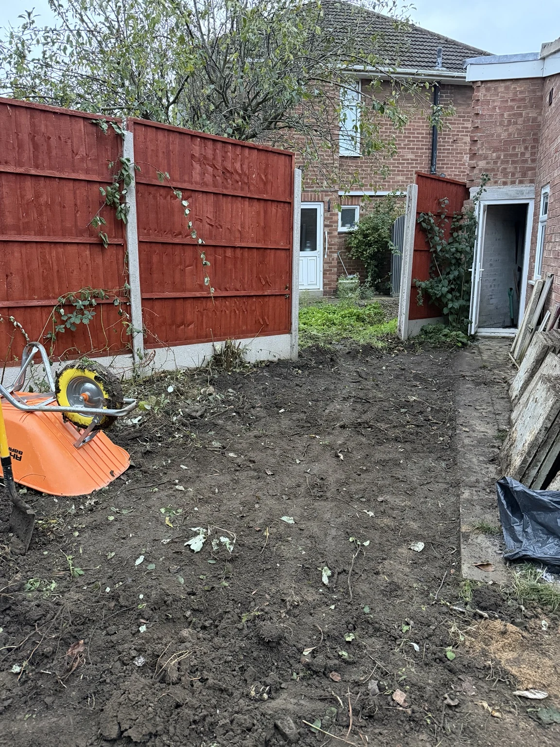 Cleared ground beside the house and garden access in Oadby, ready for further preparation