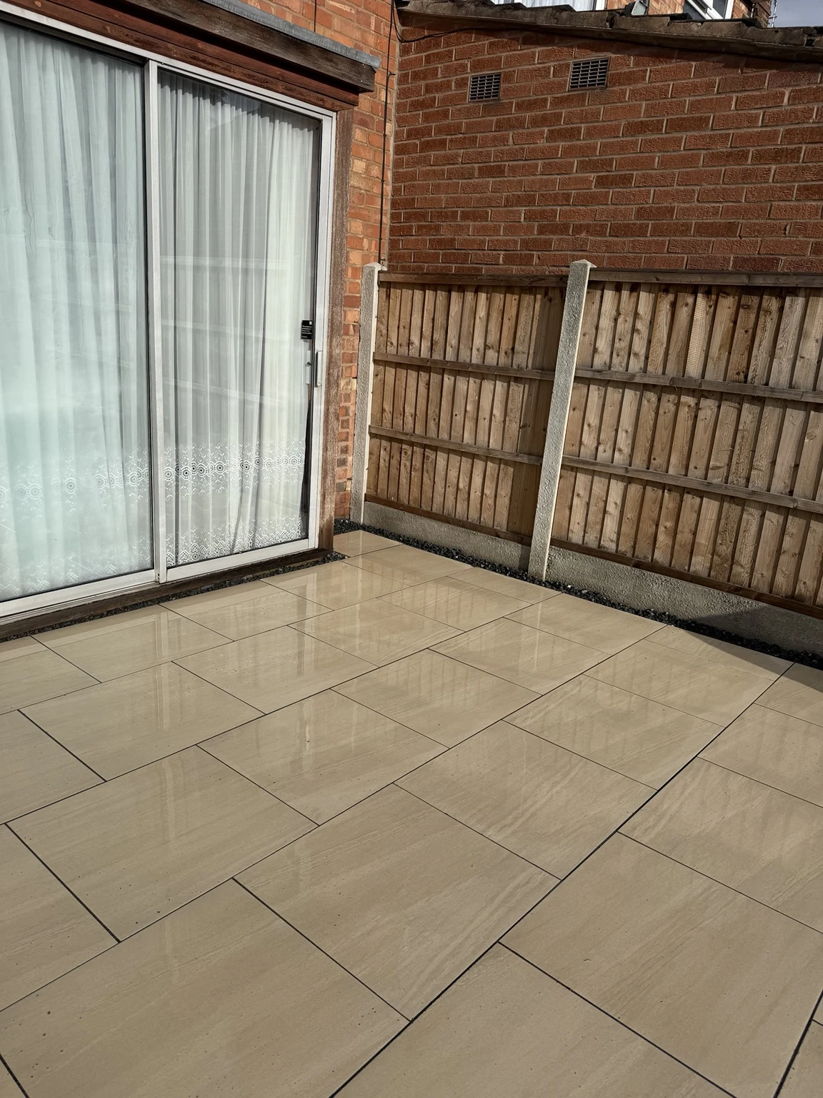 Porcelain patio beside the rear doors