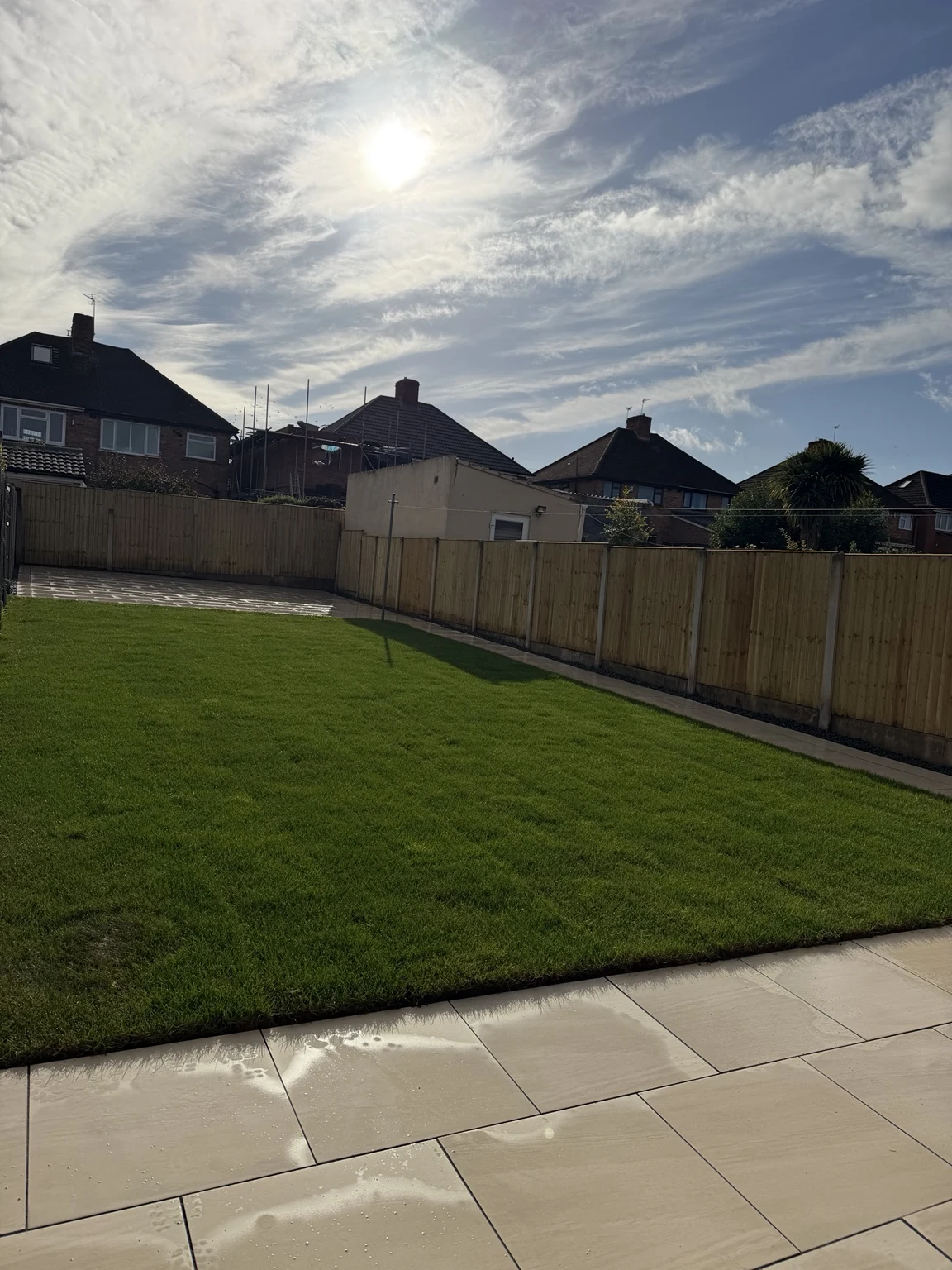 New lawn and porcelain paving in the finished garden